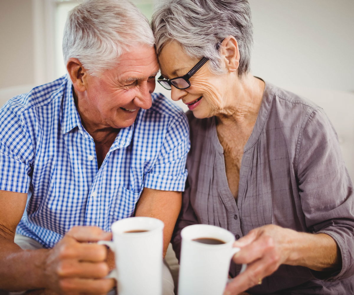 Amy Dow Elder Law Attorney Older Couple Looking Down at each other with a cup of coffee