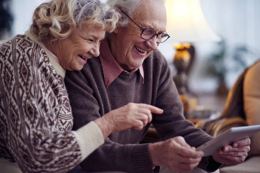 Elder Law Attorney in Palm Beach Gardens Couple looking at a tablet