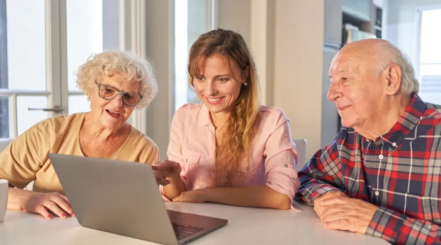 Adult child and senior parent reviewing estate planning and probate documents together, ensuring a smooth legal process with an Elder Law Lawyer