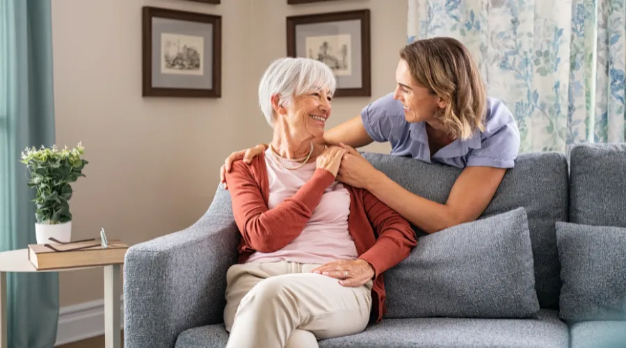 Senior parent holding hands with an adult child, symbolizing trust, security, and the importance of guardianship planning with an Elder Law Lawyer