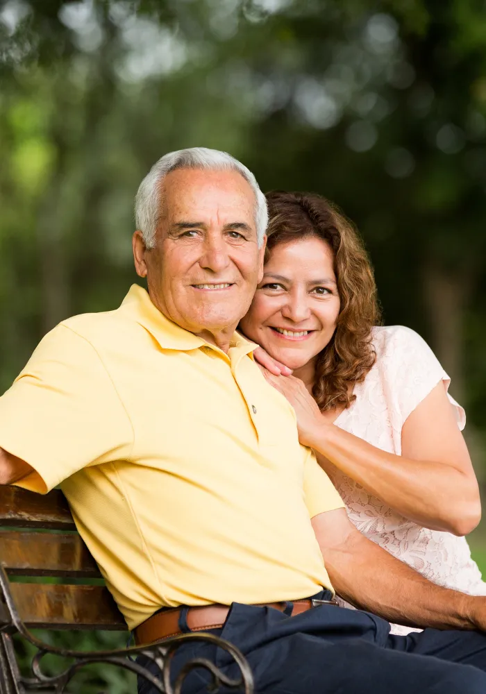 Daughter embracing her elderly father while planning Health Care Directives and Power of Attorney in Florida