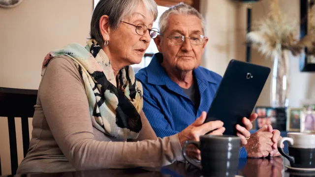 Senior couple reviewing finances and Medicaid eligibility at home